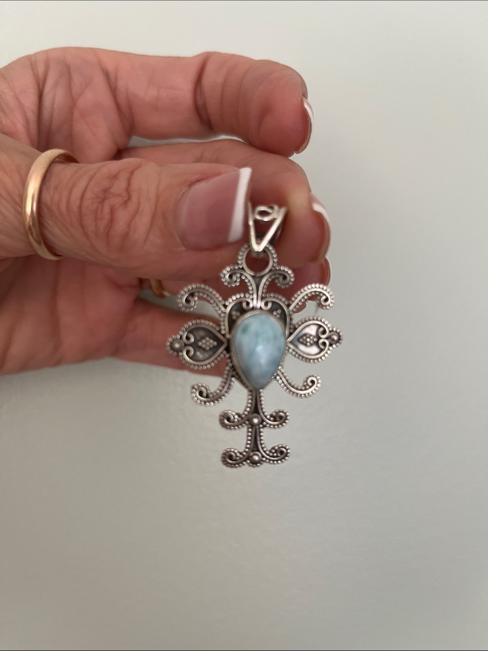 Sterling Silver Filigree Pendant with Light Blue Teardrop Stone